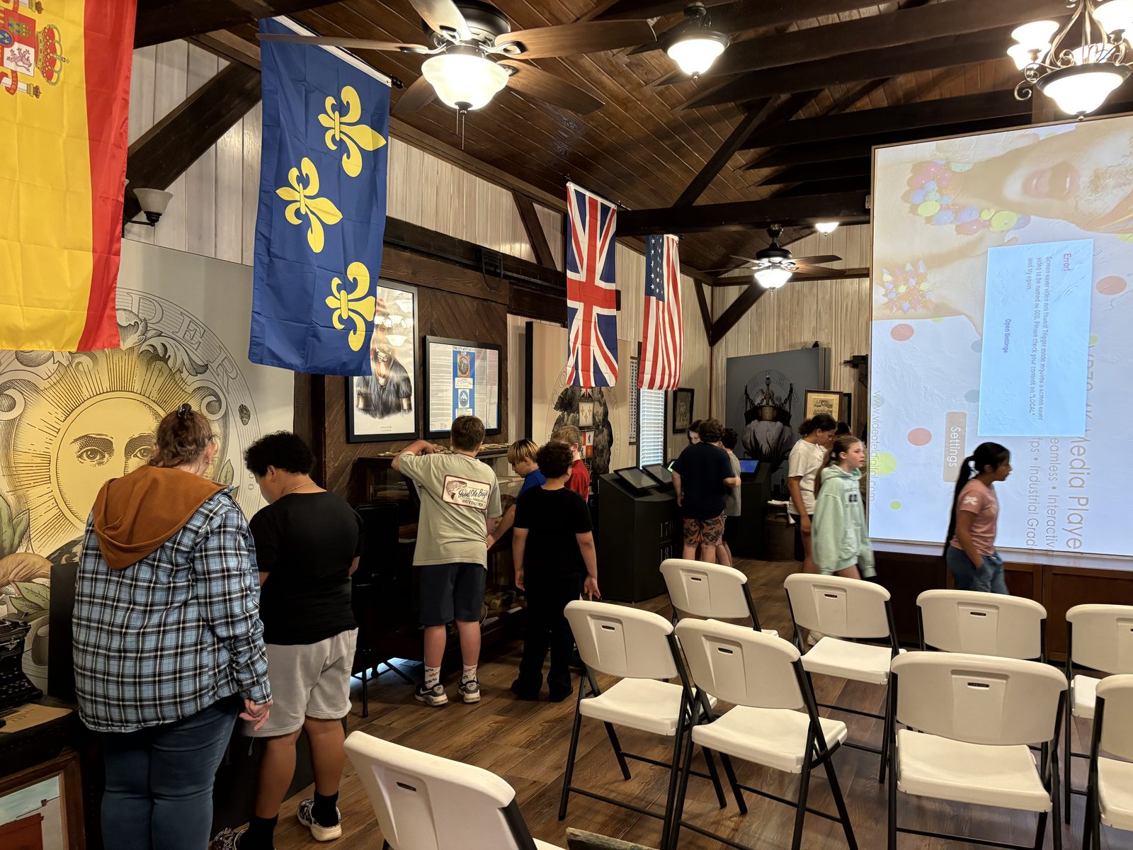 A class discovers the Cargo Room beneath the flags of Alabama's history