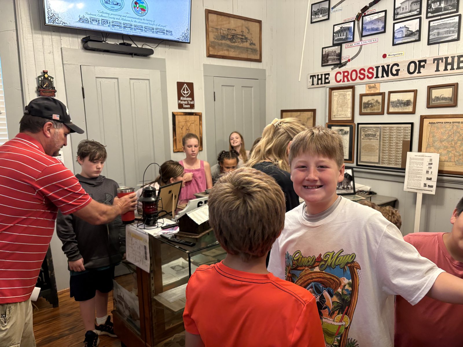 Students explore the Railroad Room with a museum guide