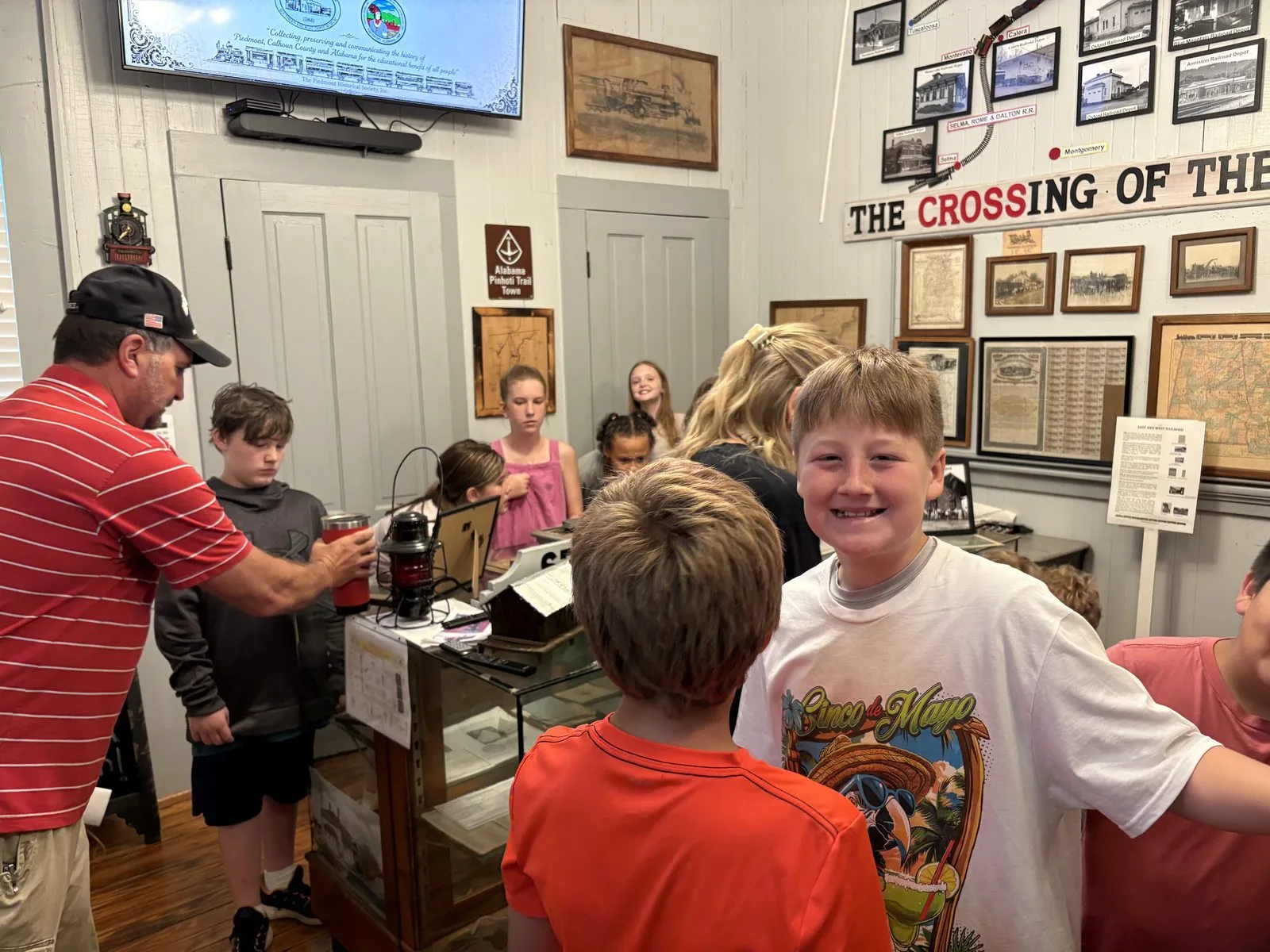 Students exploring the Railroad Room with a museum guide