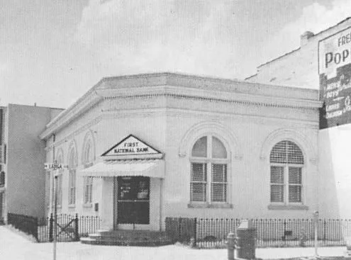 The white corner building of the First National Bank at Ladiga Street