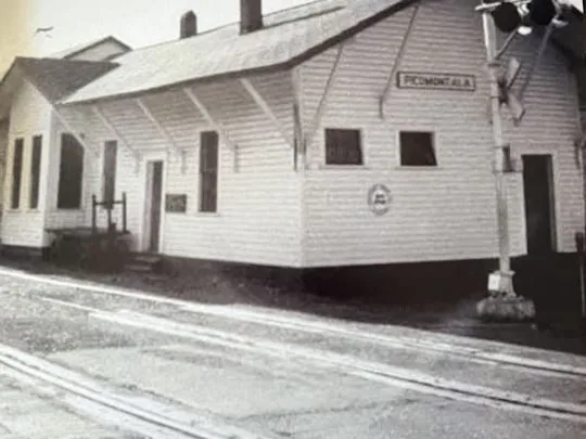 The white wooden Seaboard depot building marked Piedmont, Ala.