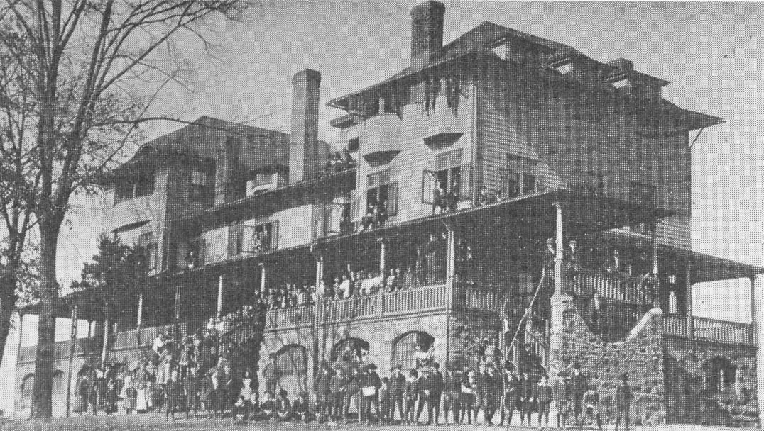 The four-story Frances E. Willard School with students on its porches